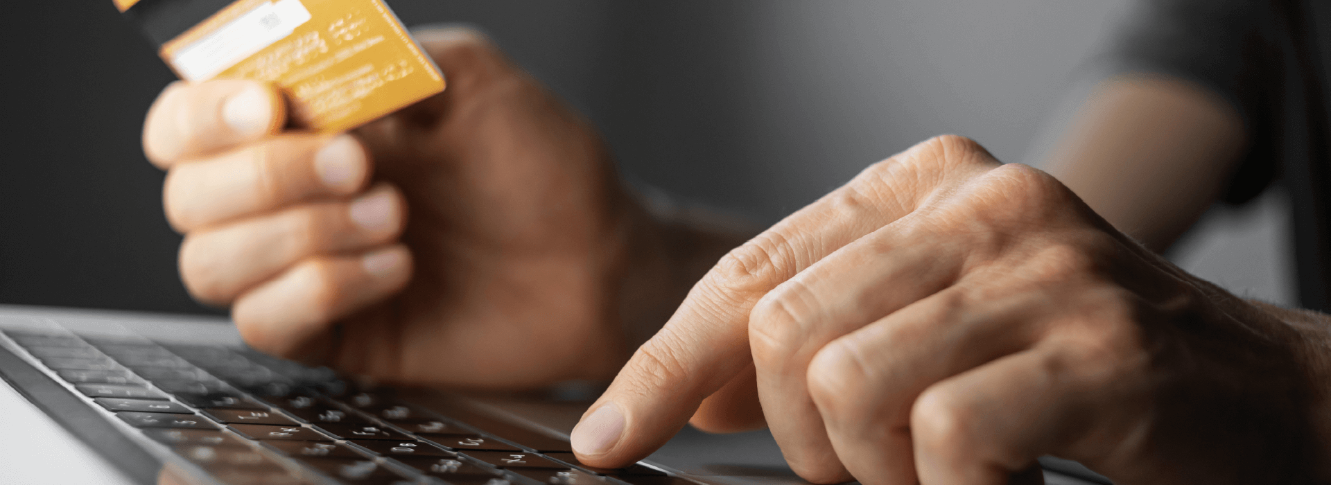 Person using debit/credit card to shop online