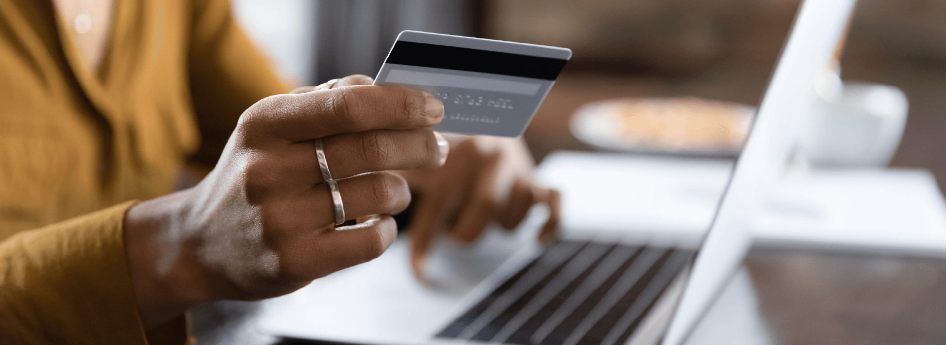 Hand holding a debit card